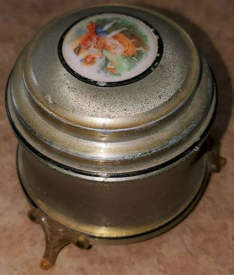 vintage round metal music box with mother of pearl top|Vintage Metal Music Box .